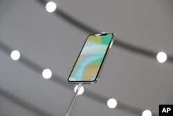 The new iPhone X is displayed in the showroom after the new product announcement at the Steve Jobs Theater on the new Apple campus in Cupertino, California, Sept. 12, 2017.
