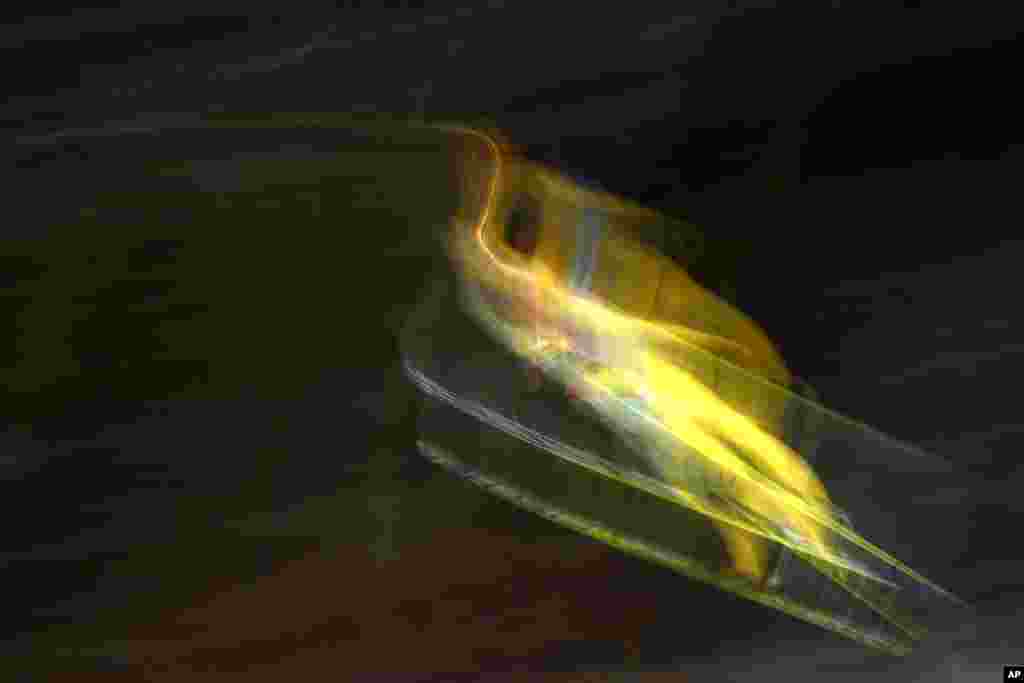 Noriaki Kasai of Japan soars through the air during his trial jump at the fourth stage of the 64. four hills ski jumping tournament in Bischofshofen, Austria.