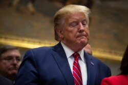 President Donald Trump pauses during an event on healthcare prices in the Roosevelt Room of the White House, Nov. 15, 2019, in Washington.