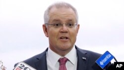 Australia's Treasurer Scott Morrison addresses reporters outside Parliament House in Canberra, Australia, May 8, 2018.