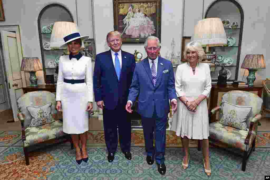 U.S. President Donald Trump and his wife Melania, left, pose for a photo with Britain&#39;s Prince Charles and Camilla, the Duchess of Cornwall prior to afternoon tea at Clarence House, in London, June 3, 2019.