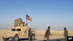 Afghan National Army soldiers arrive near the site of a blast in Helmand province, March 7, 2012