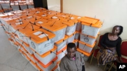 Polling agents guard ballot boxes as counting of ballot papers continues a day after presidential elections in Lusaka, Zambia, Jan, 21, 2015. 