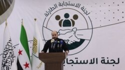 شام کے باغی گروپ حیات تحریر الشام کے محمد بشیر 28 نومبر 2024 کو ادلب میں ایک پریس کانفرنس کے دوران۔ فوٹو اے ایف پی