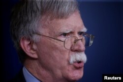 FILE - U.S. national security adviser John Bolton answers questions from reporters after announcing that the U.S. will withdraw from the Vienna protocol and the 1955 "Treaty of Amity" with Iran, during a news conference in the White House briefing room in Washington, Oct. 3, 2018.
