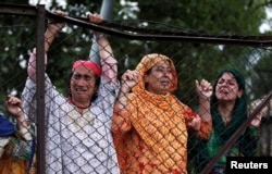 Kashmiri women mourn the death of Burhan Wani, a separatist militant leader, during his funeral in Tral, south of Srinagar, July 9, 2016.
