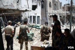 Soldiers with Iraqi Special Forces Najaf Battalion explode IEDs littering the roads in recently recaptured areas of Old Mosul on June, 30, 2017 in Mosul, Iraq. (H.Murdock/VOA)