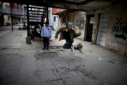 FILE - A youth controls a soccer ball outside apartments in the Fuerte Apache neighborhood in Buenos Aires, Argentina, June 15, 2020. The Argentina office of UNICEF says the child poverty rate in Argentina could reach 58.6% by year's end.