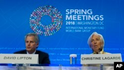 International Monetary Fund (IMF) Managing Director Christine Lagarde accompanied by First Deputy Managing Director, David Lipton, speaks during a news conference at the World Bank/IMF Spring Meetings, in Washington, April 19, 2018. 