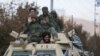 Members of Taliban sit on a military vehicle during Taliban military parade in Kabul, November 14, 2021. (Ali Khara/Reuters)