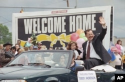 In this June 22, 1992 file photo, former hostage Terry Anderson waves to the crowd as he rides in a parade in his honor in Lorain, Ohio.