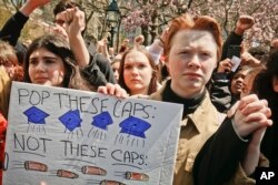 High school students protest during a rally calling for stronger laws on firearms, April 20, 2018, in Washington Square Park, New York.