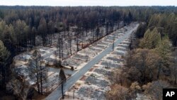 Homes leveled by the Camp Fire line the Ridgewood Mobile Home Park retirement community in Paradise, Calif., on Monday, Dec. 3, 2018.