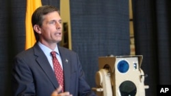 U.S. Sen. Martin Heinrich, D-N.M., discusses the potential of high-energy laser weapons systems being developed by engineers at Boeing during a news conference in Albuquerque, N.M., Aug. 23, 2017.