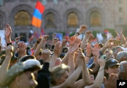 FILE - Supporters of then-opposition lawmaker Nikol Pashinyan, many of the rallying against corruption and mismanagement, protest in Republic Square in Yerevan, Armenia, May 2, 2018. Less than a week later, Pashinyan was sworn in as prime minister.