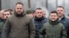 FILE - Ukrainian President Volodymyr Zelenskiy, right, and Andriy Yermak, left, a senior aide whom Zelenskiy appointed chief of staff, visit the frontlines in Ukraine's war with Russia-backed separatists, in Stanytsia Luhanska, Nov. 20, 2019. 
