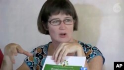 FILE - In this image made from video by Radio Free Asia, former British Ambassador Vicky Bowman talks to reporters in Yangon, Myanmar, on Sept. 5, 2014. (Radio Free Asia via AP)