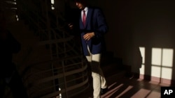 A student walks in a corridor at the Limanowski High School in Warsaw, Poland, Sept. 1, 2022.