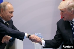 U.S. President Donald Trump shakes hands with Russian President Vladimir Putin during the their bilateral meeting at the G-20 summit in Hamburg, Germany, July 7, 2017.