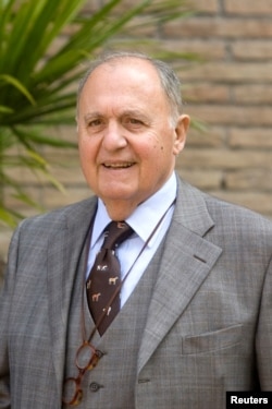 FILE - Paolo Savona poses for a picture during a meeting in Rome, Italy, April 11, 2011.