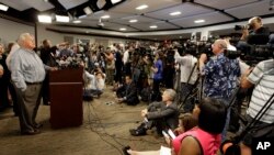Mayor Keith Summey, left, speaks about the shooting death of Walter Scott during a news conference at city hall in North Charleston, South Carolina, April 8, 2015. 