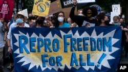 FILE - Abortion rights demonstrators march in Chevy Chase, Maryland, Sept. 13, 2021, after a high-profile decision earlier this month in which the U.S. Supreme Court by 5-4 vote declined to step in to stop a Texas law banning most abortions from going into effect.