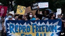 Abortion rights demonstrators march to the Supreme Court Justice Brett Kavanaugh's home in Chevy Chase, Md. Monday Sept. 13, 2021, after a high-profile decision earlier this month in which the court by 5-4 vote declined to step in to stop a Texas…