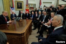 FILE - U.S. President Donald Trump listens as he meets with China's Vice Premier Liu He in the Oval Office of the White House in Washington, Jan. 31, 2019.