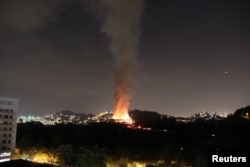 A fire blazes at the National Museum of Brazil in Rio de Janeiro, Brazil, Sept. 2, 2018, in this picture obtained from social media.