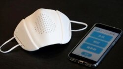 Japanese startup Donut Robotics' c-mask and its mobile phone application is pictured during a demonstration in Tokyo, Japan June 23, 2020. Picture taken June 23, 2020. (REUTERS/Kim Kyung-Hoon)