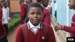 Ronnie Lutepo, who attends secondary school, says he missed classes despite classwork assistance he received from his mother when the schools were closed. (Lameck Masina/VOA)
