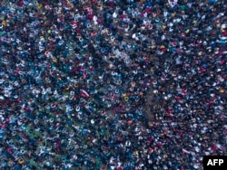 This aerial view taken on Jan. 16, 2023 shows Iraq supporters gathering in a designated fan zone in Iraq's southern city on to watch the Arabian Gulf Cup semi-final football match between Iraq and Qatar.