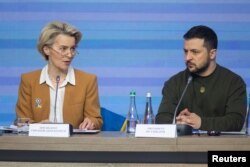 In this Ukrainian Presidential Press Service photo, European Commission President Ursula von der Leyen and Ukrainian President Volodymyr Zelenskyy attend an EU summit in Kyiv, Ukraine, Feb. 2, 2023, as Russia's attack on Ukraine continues.