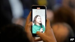 Climate activist Greta Thunberg of Sweden is pictured on a mobile phone while speaking during a press conference at the World Economic Forum in Davos, Switzerland, Jan. 19, 2023.