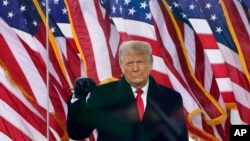 FILE - President Donald Trump gestures as he arrives to speak at a rally on Jan. 6, 2021, in Washington, DC. (AP Photo/Jacquelyn Martin, File)