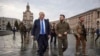 In this image provided by the Ukrainian Presidential Press Office, Ukrainian President Volodymyr Zelenskyy, center right, and Britain's Prime Minister Boris Johnson, center left, walk during Johnson's visit, in downtown Kyiv, Ukraine, April 9, 2022.