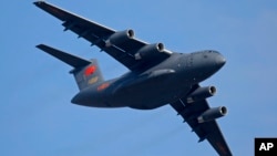 FILE - A Y-20 Chinese military transport plane is seen during an airshow in Zhuhai city, southern China, Nov. 7, 2018. Media and military experts said Sunday that six Chinese Y-20 planes landed in Belgrade Saturday, reportedly carrying surface-to-air miss