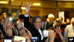 Lawyers and supporters of Pakistani opposition parties celebrate after a Supreme Court decision, in Islamabad, Pakistan, April 7, 2022. 