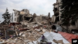 FILE - A view of the Mariupol theater damaged during fighting in Mariupol, in territory under the government of the Donetsk People's Republic, eastern Ukraine, April 4, 2022.