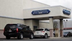Vehicles line up at a self-swabbing coronavirus disease (COVID-19) test at a Rite Aid drive-thru during the outbreak of COVID-19, in Pasadena, California, Jan. 22, 2021.