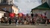 People stand near a memorial to Russian mercenary chief Yevgeny Prigozhin, who died in a plane crash last year, in Moscow on July 29, 2024. Prigozhin's Wagner unit suffered heavy losses in an attack in Mali last week.