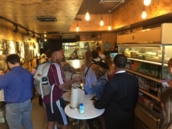 Falafel Inc. in Washington, D.C. uses some of the proceeds from its Palestinian-inspired falafel sandwiches to help employ and feed refugees. (Julie Taboh/VOA)