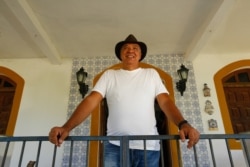 Brazilian Henrique Almeida, owner of the Sagarama cocoa farm, poses for a photo in Coaraci, Bahia state, Brazil, Dec. 12, 2019.