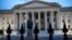 FILE - The U.S. Treasury Department building is seen at dusk, June 6, 2019, in Washington. 