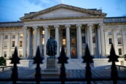 The U.S. Treasury Department building at dusk, June 6, 2019, in Washington.