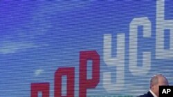 Incumbent Belorussian President Alexander Lukashenko before a news conference after preliminary election results show him overwhelmingly winning a fourth term in Minsk, Dec. 20, 2010.