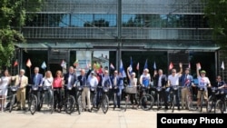 EU members' diplomatic representatives gather at the Finnish Embassy before biking toward the EU ambassador’s residence in Washington, July 25, 2019. (Delegation of the European Union to the United States)