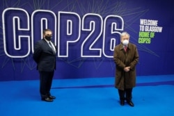 UN Secretary-General Antonio Guterres poses for a photo as he arrives for the UN Climate Change Conference (COP26) in Glasgow, Scotland, Britain, Nov. 1, 2021.