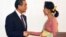 Leader of the National League for Democracy party (NLD) and Myanmar's new foreign minister, Aung San Suu Kyi, shakes hands with Chinese Foreign Minister Wang Yi, left in Naypyitaw, Myanmar, April 5, 2016. 