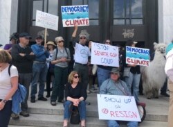 Protesters flood the steps of the Oregon Capitol, June 25, 2019, to push back against a Republican walkout over a climate change bill that has entered its sixth day in Salem, Ore.